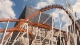hirmer wiesn roller coaster in front of the synagogue munich